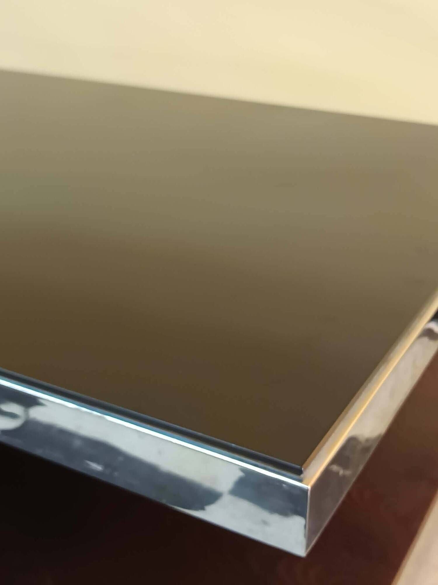 Designer coffee table in glass and chrome metal.