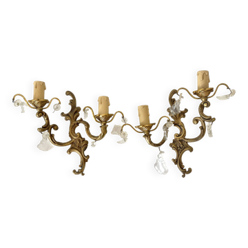 Pair of brass wall lights with rococo-style tassels
