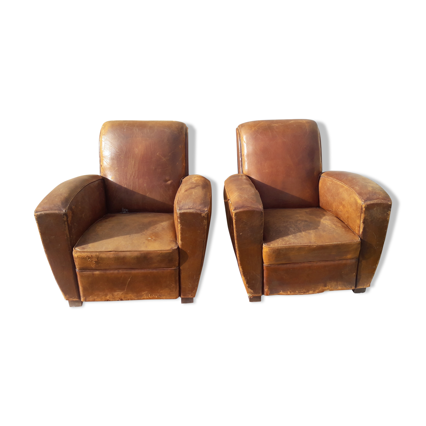 Pair of brown leather club chairs