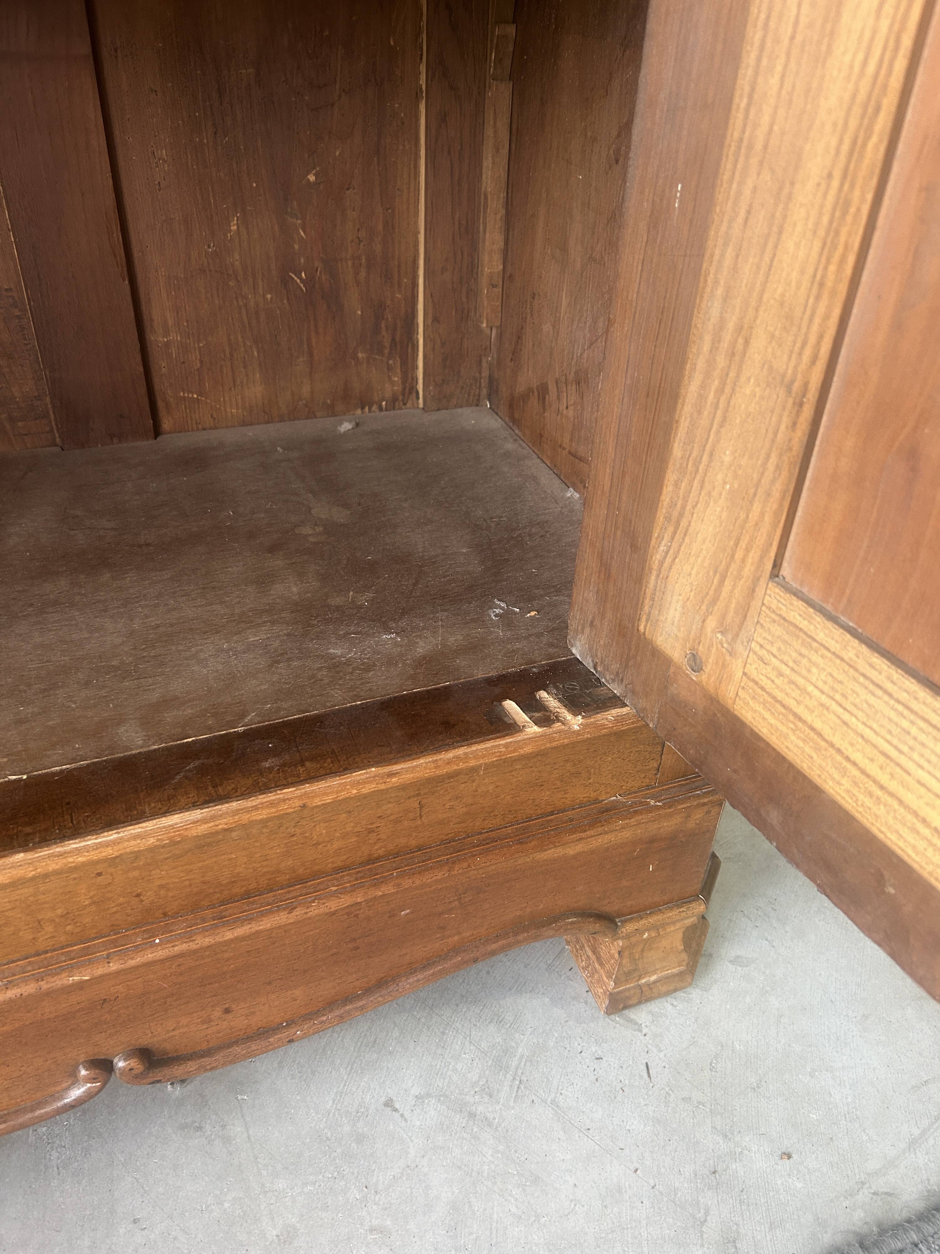 Antique Louis-Philippe walnut veneered wardrobe with an antique mirror.