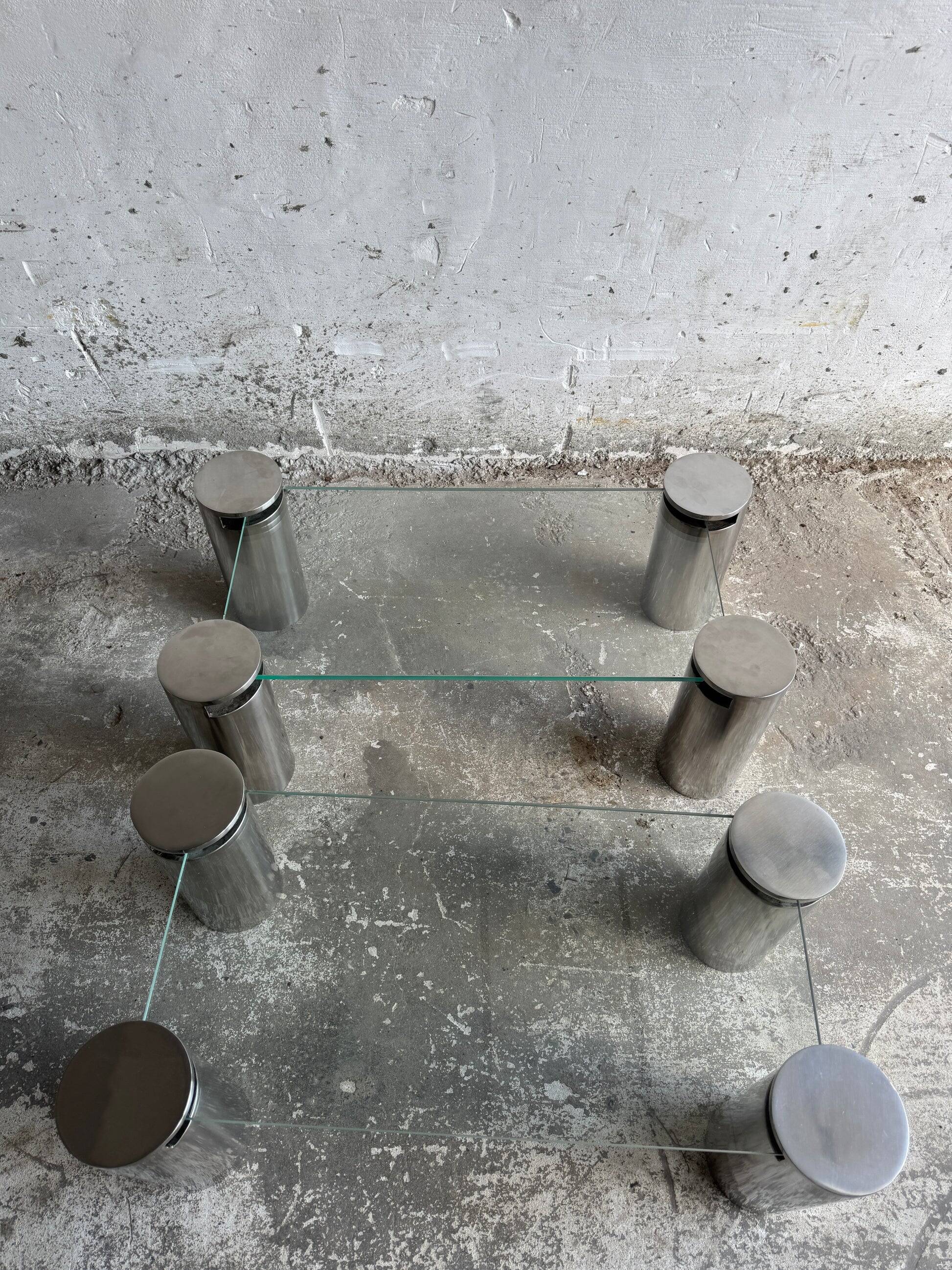 Pair of modernist coffee tables with cylindrical steel legs