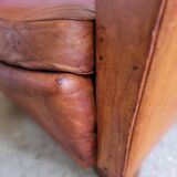 Fauteuil club en cuir patiné