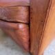 Patinated leather club armchair
