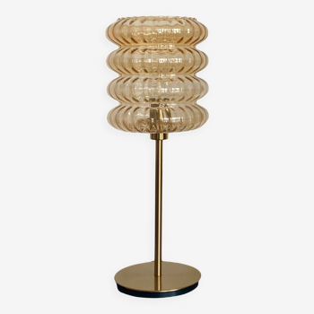 Table lamp with vintage golden streaked globe and golden foot