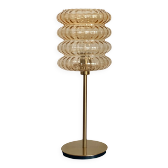 Table lamp with vintage golden streaked globe and golden foot