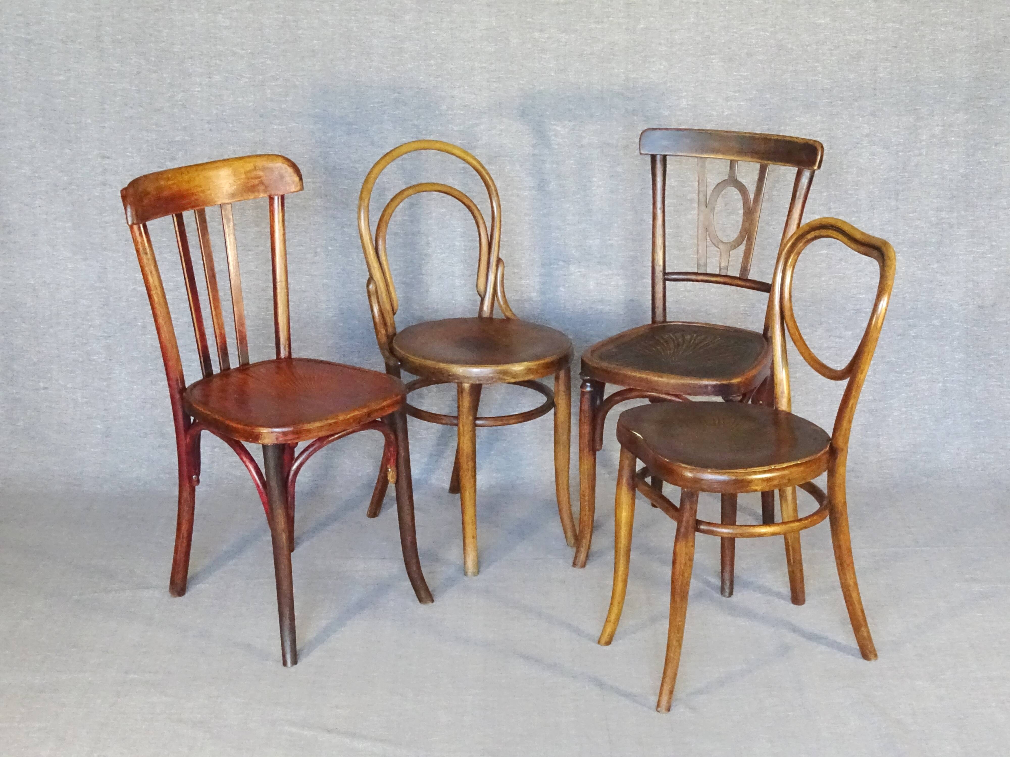 Set of 4 mismatched bistro chairs, 1900 to 1930 with wooden seats, Thonet, Baumann