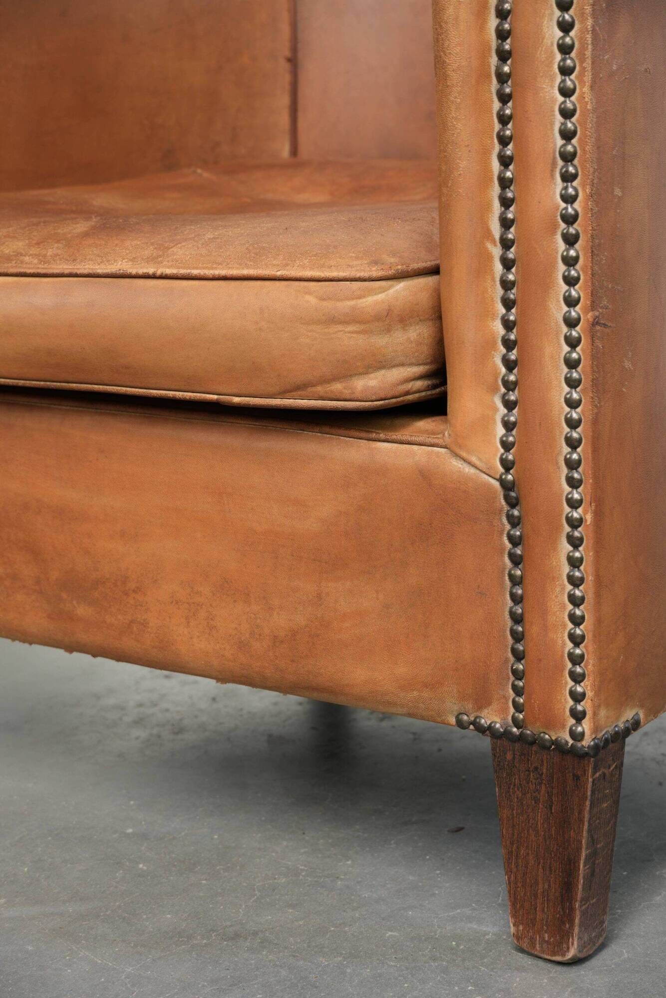 Vintage sheepskin club armchair in a beautiful light cognac colour