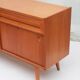 1950s cherry wood sideboard with sliding doors.