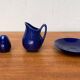 Swedish Salier Mid-Century Bla Eld, Salt Shaker, Milk Jug, Saucer and Plate by Hertha Bengtson for Rörstrand, 1960s, Set of 4