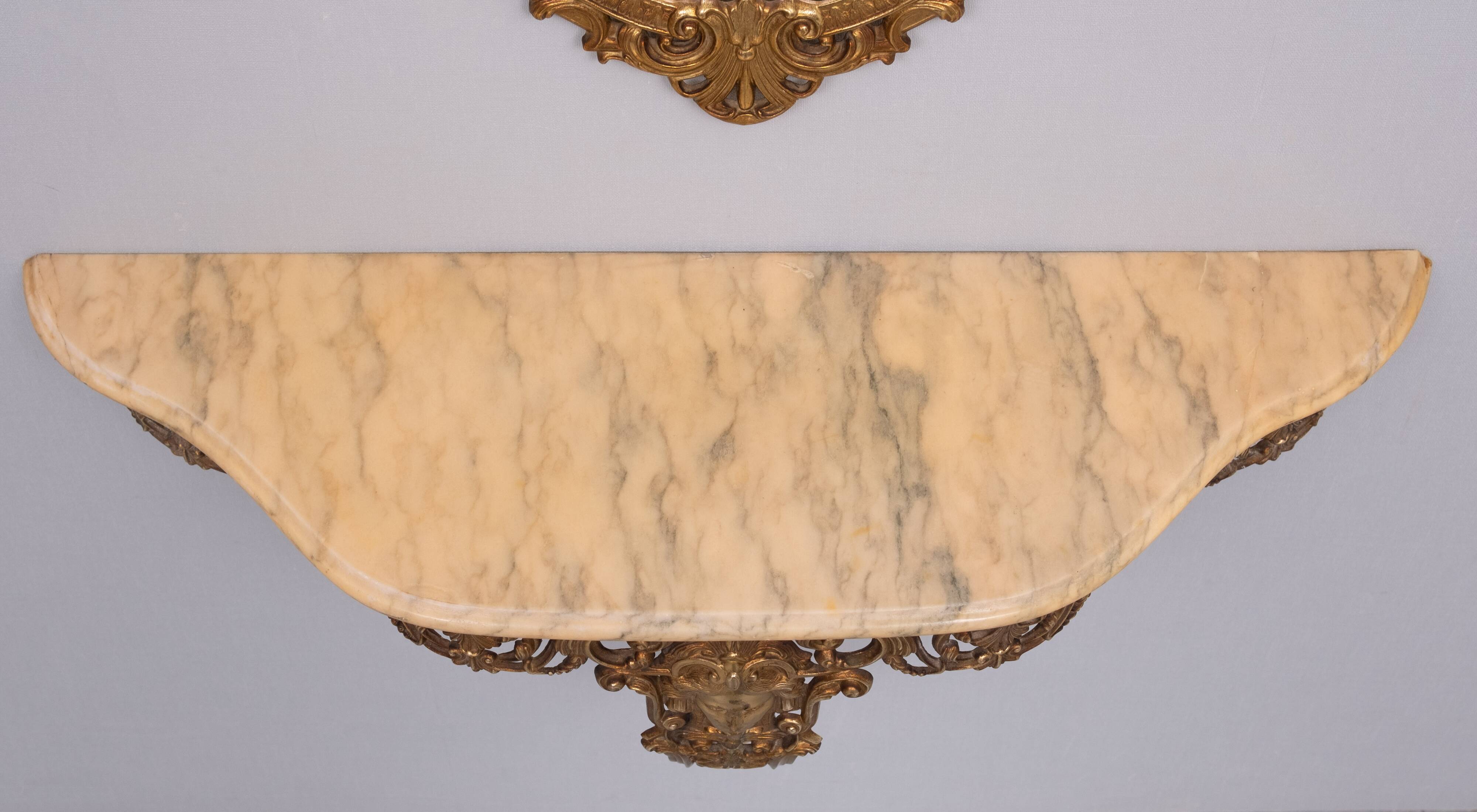 Classic gilded brass console with oval mirror from the 1950s, Italy.