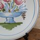 Plate with hand-painted flower bouquet on light blue background 25cm