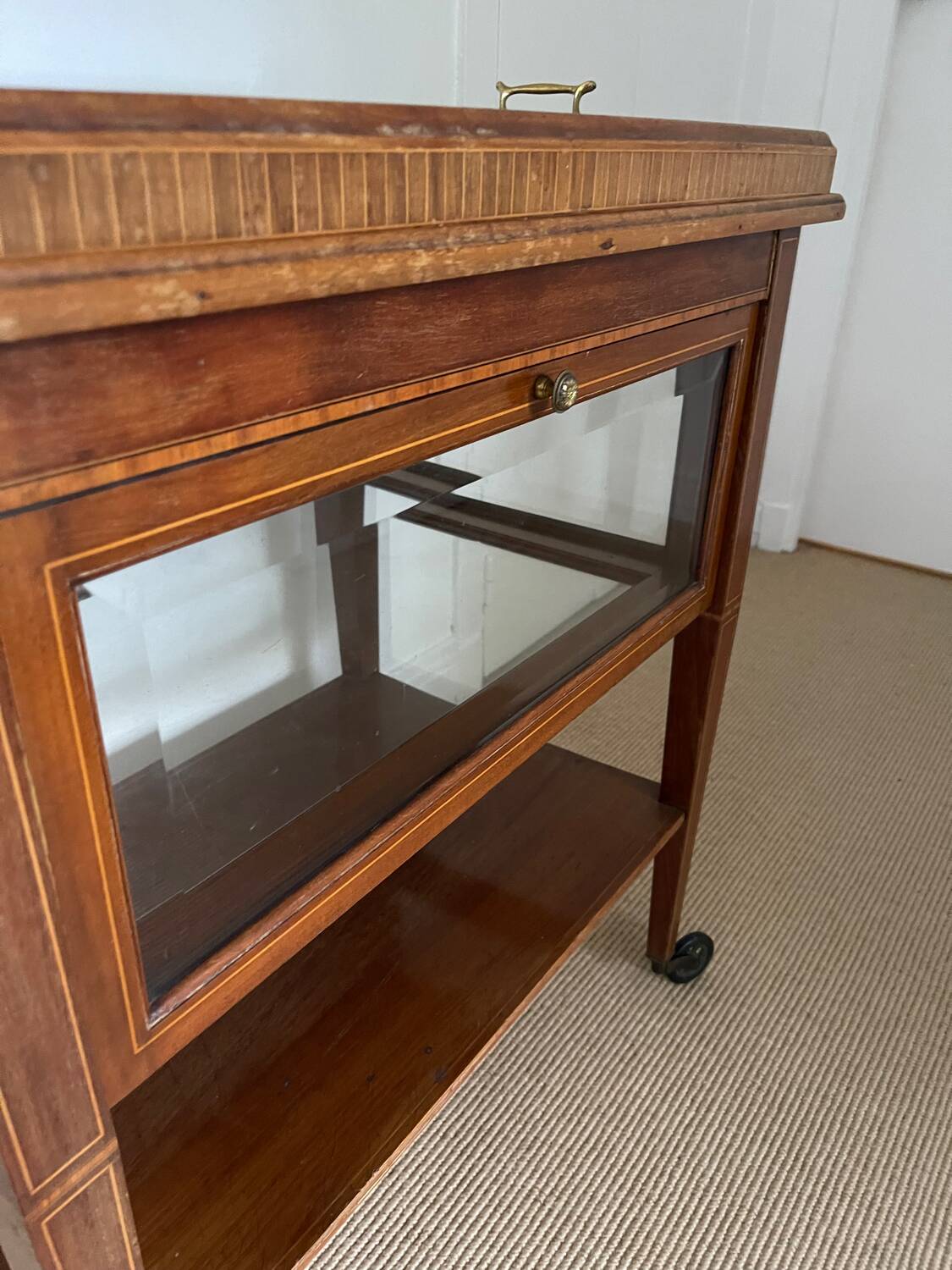 Serving Light mahogany English tea table. Beveled windows. circa 1900. Removable glass top.