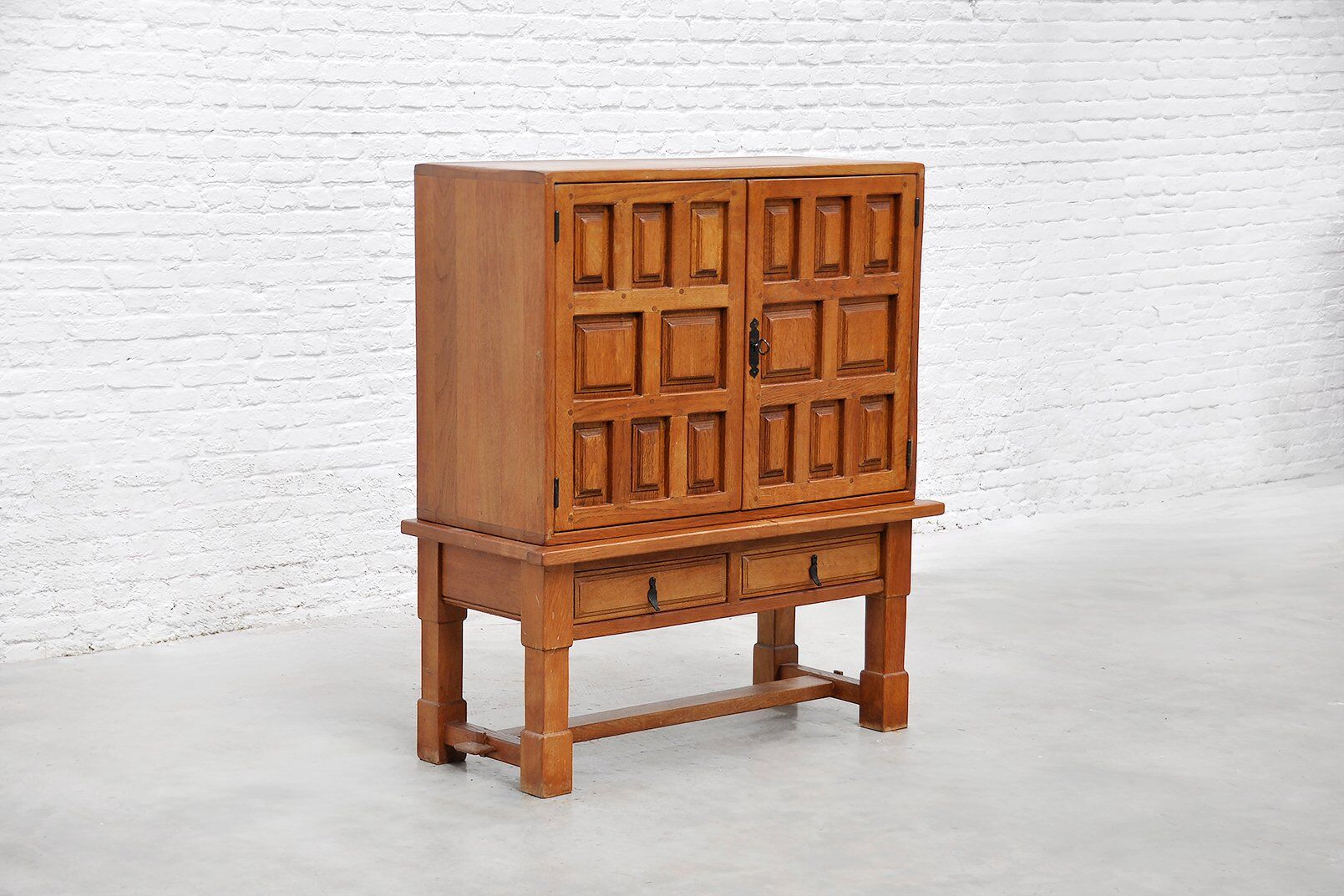 Brutalist Spanish oak cabinet with wrought-iron hardware, 1940s