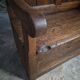 Rustic French antique storage bench from the 18th century in walnut and pine.