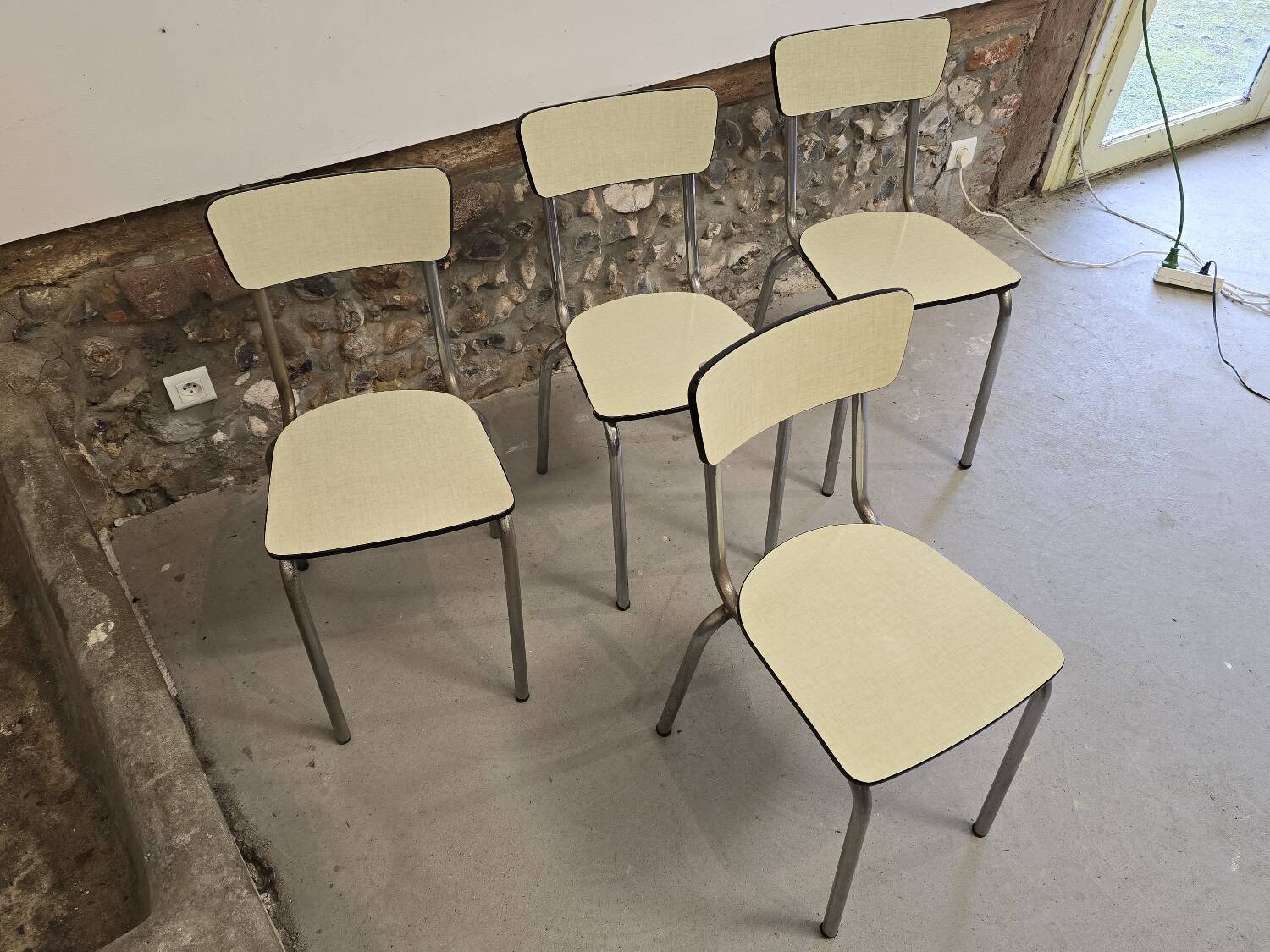 Set of 4 light yellow formica chairs