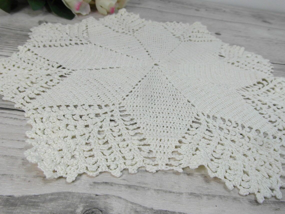 Handmade round placemat in crocheted cotton lace