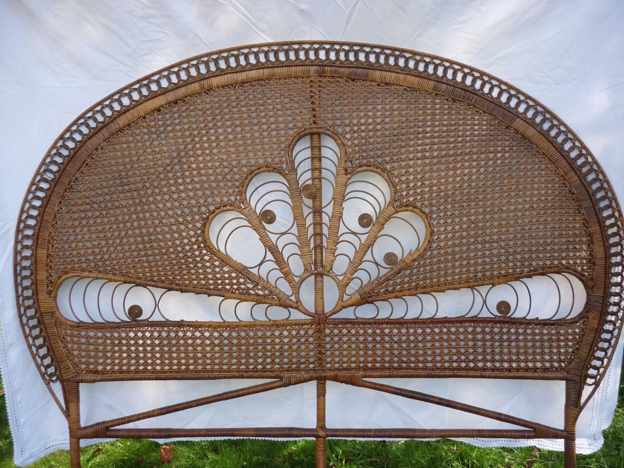Braided and caning head of bed in wicker and rattan peacock