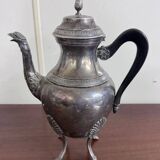 Empire style silver-plated verseuse, resting on three sculpted feet.