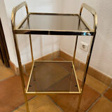 Gold metal and smoked glass console table.