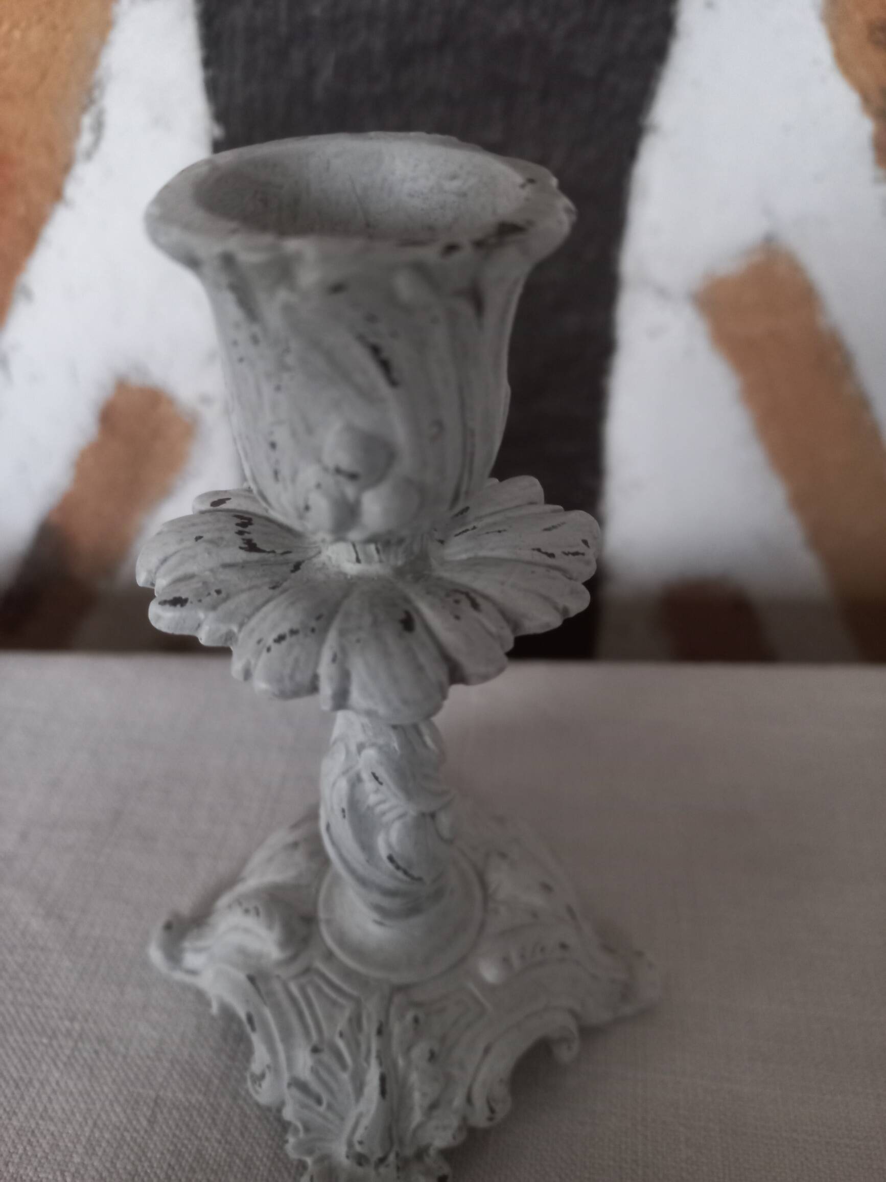 Old grayed white patinated candle holder