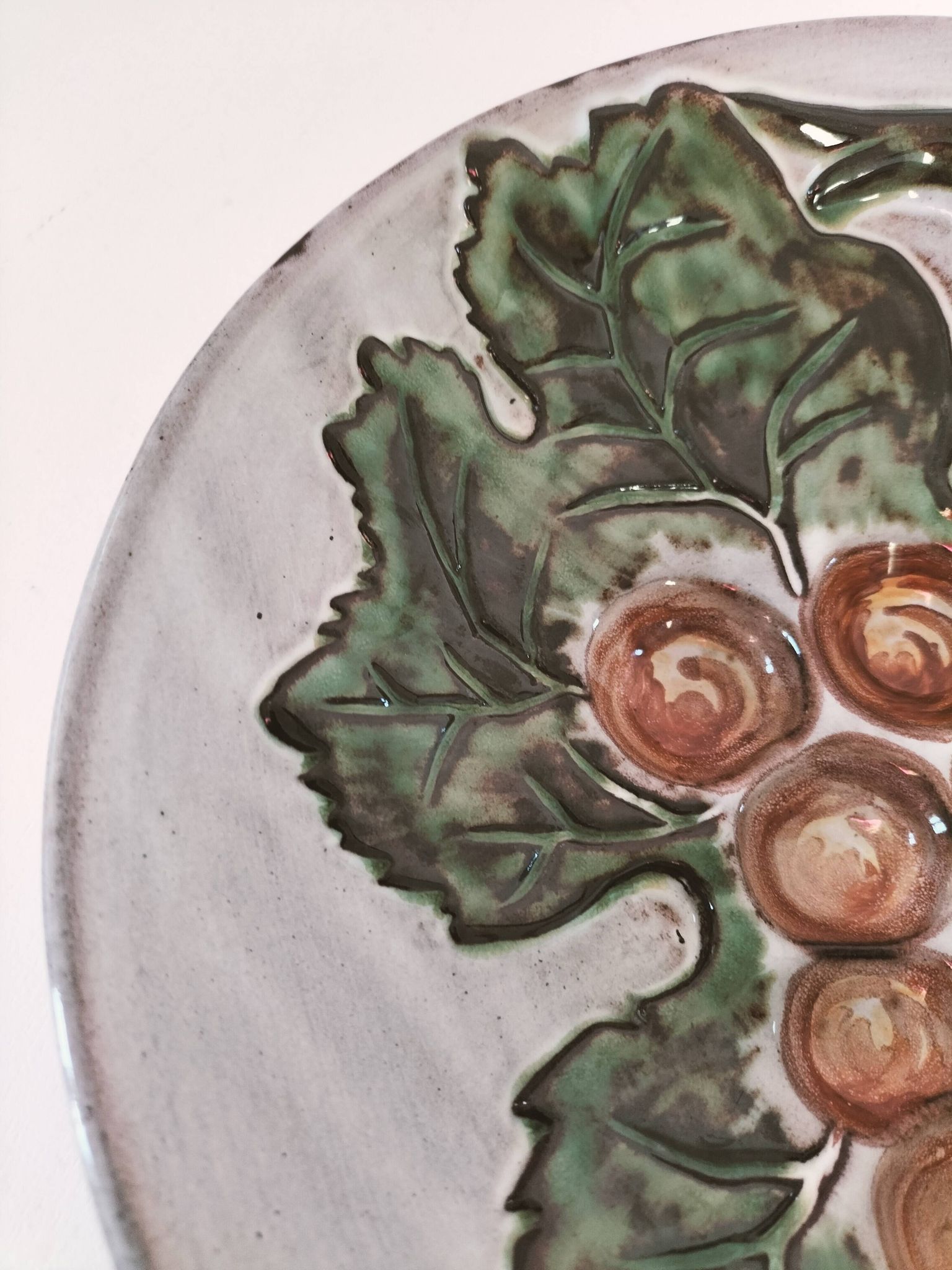 Vintage ceramic bowl – embossed grape pattern in slip style