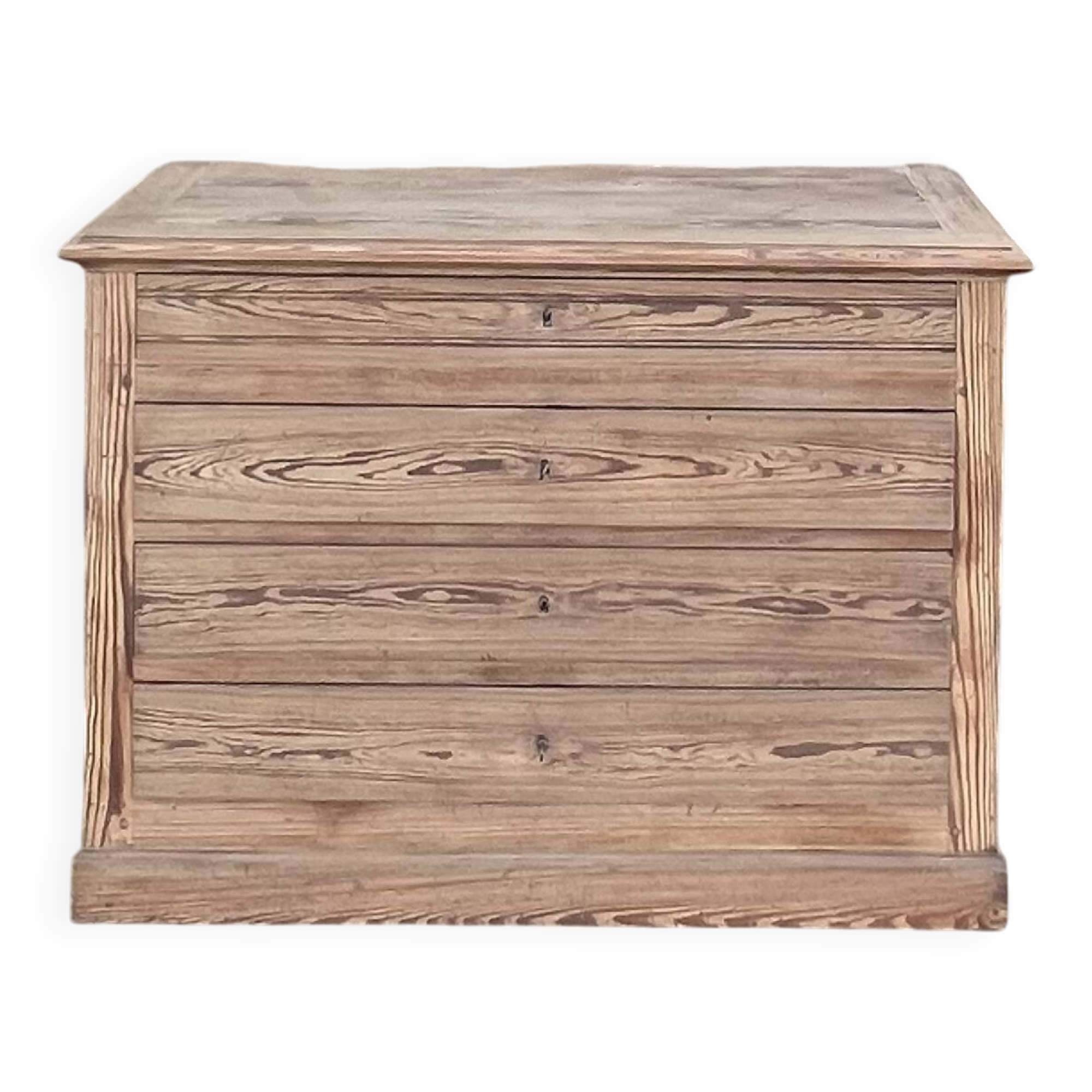 Large antique chest of drawers in raw solid wood.