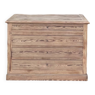 Large antique chest of drawers in raw solid wood.