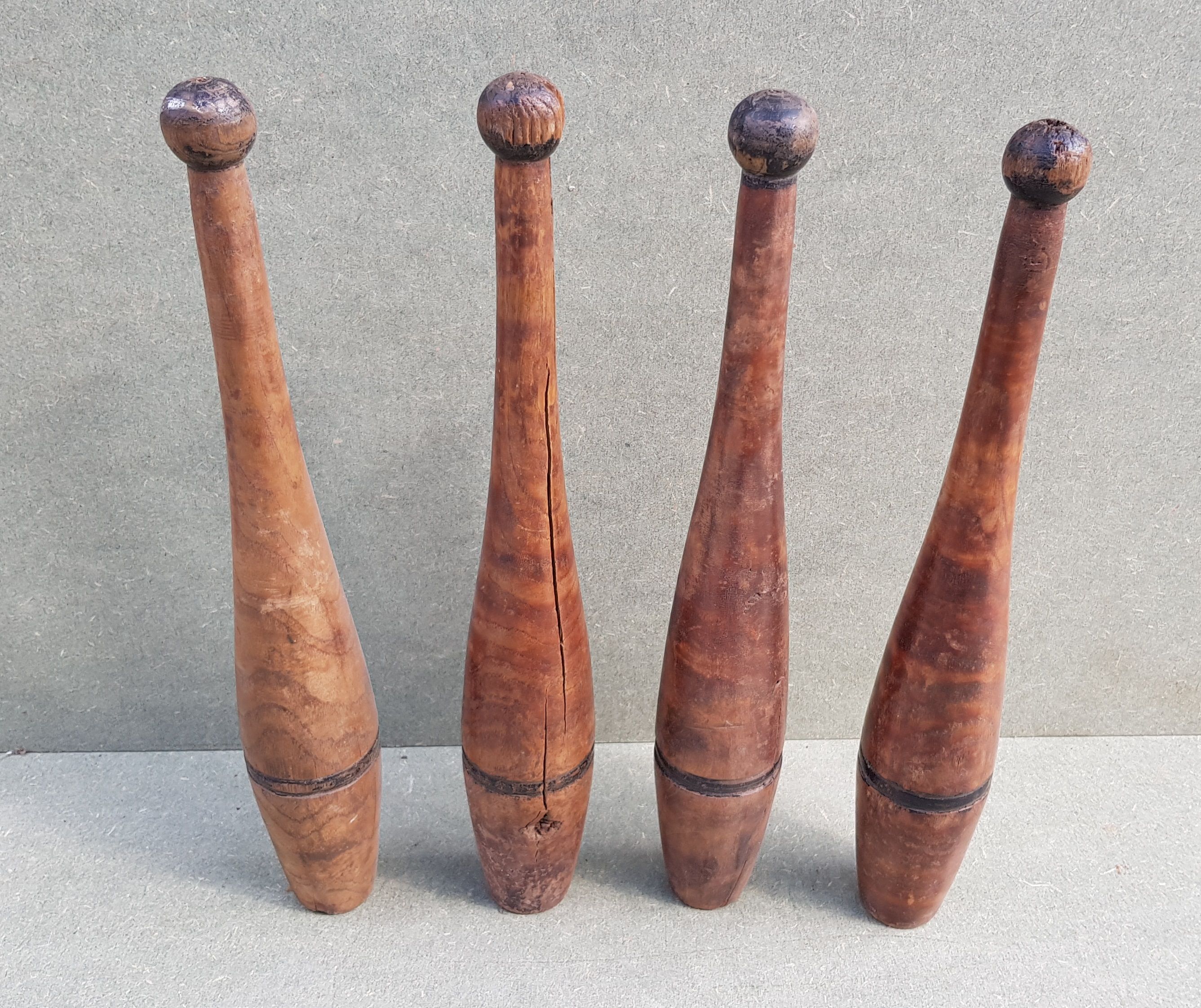 Set of 4 old English juggling clubs circa late 19th