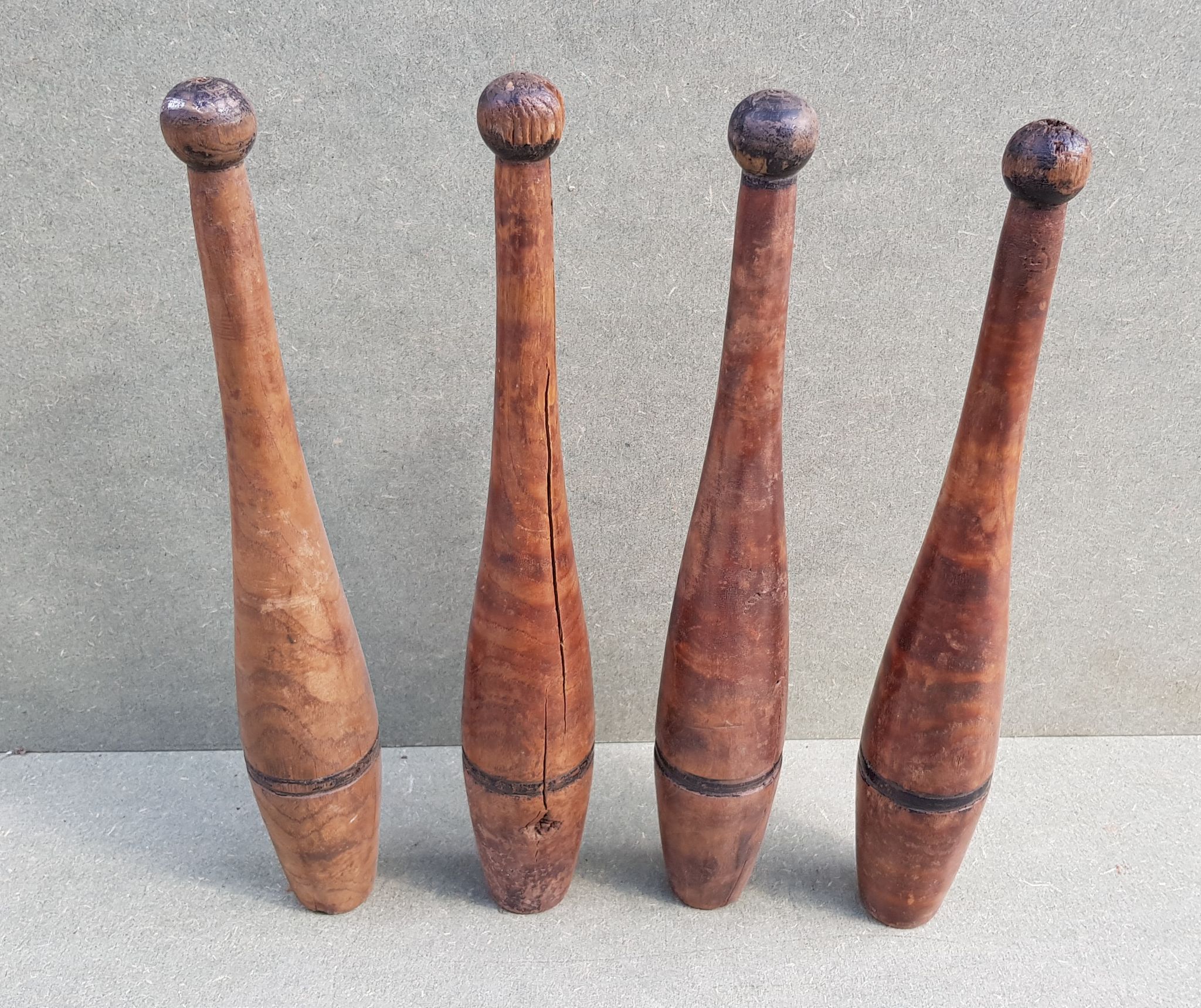 Set of 4 old English juggling clubs circa late 19th