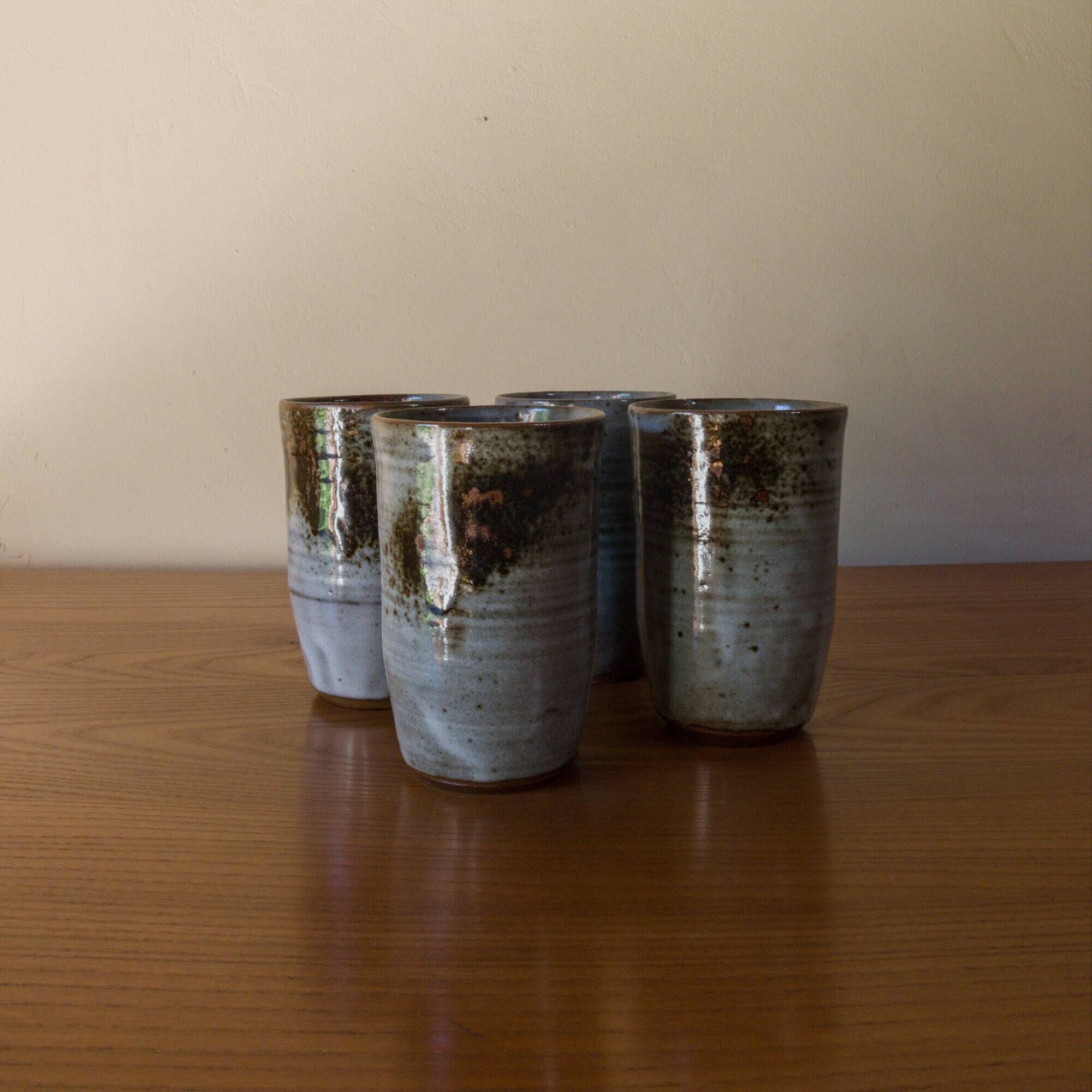 Set of 4 glazed stoneware mugs signed by Thierry and Chantal Robert.