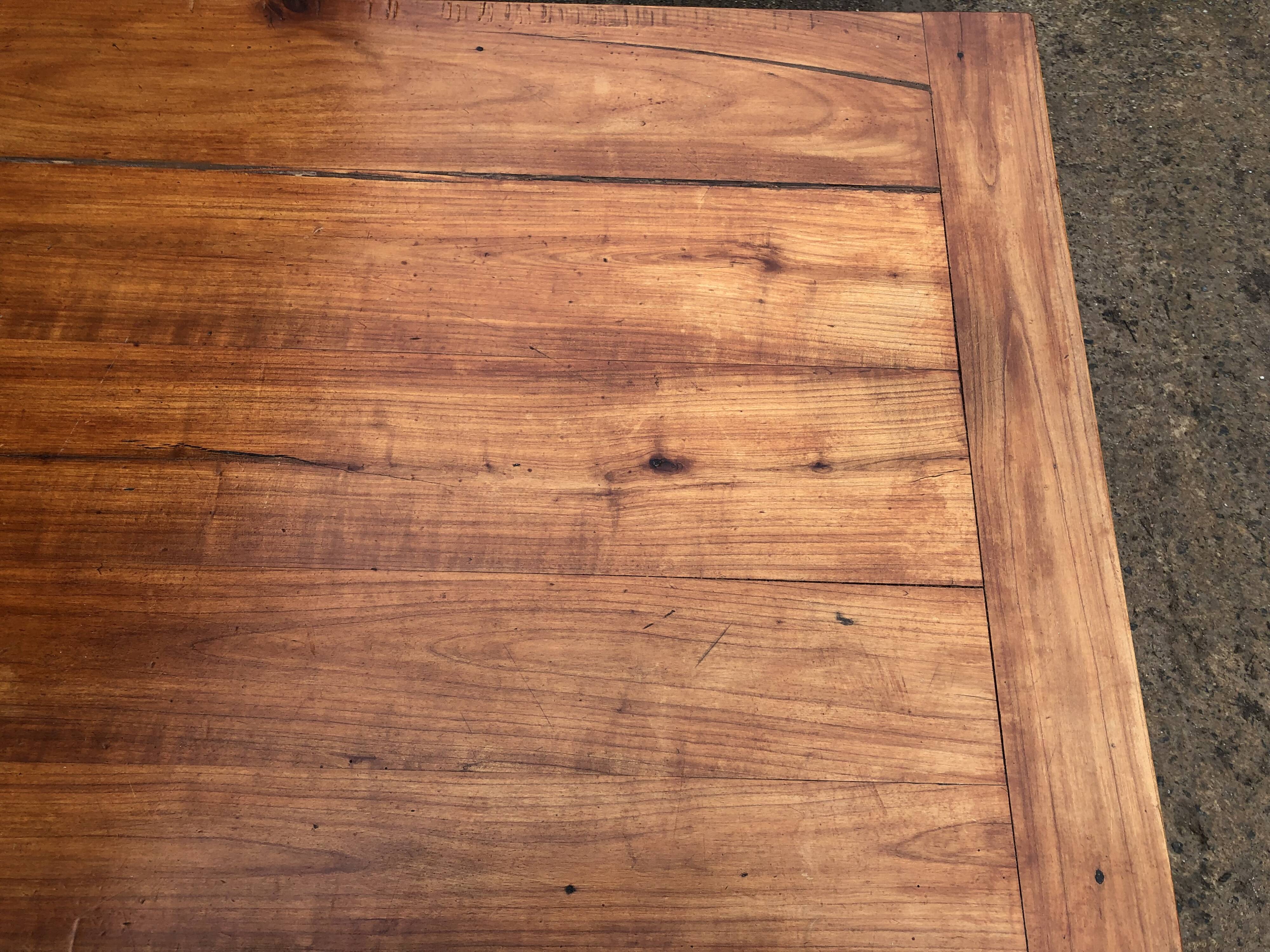 Antique farmhouse table in solid cherry wood with 3 drawers and 1 pull-out.