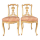 Pair of gilded wooden chairs
