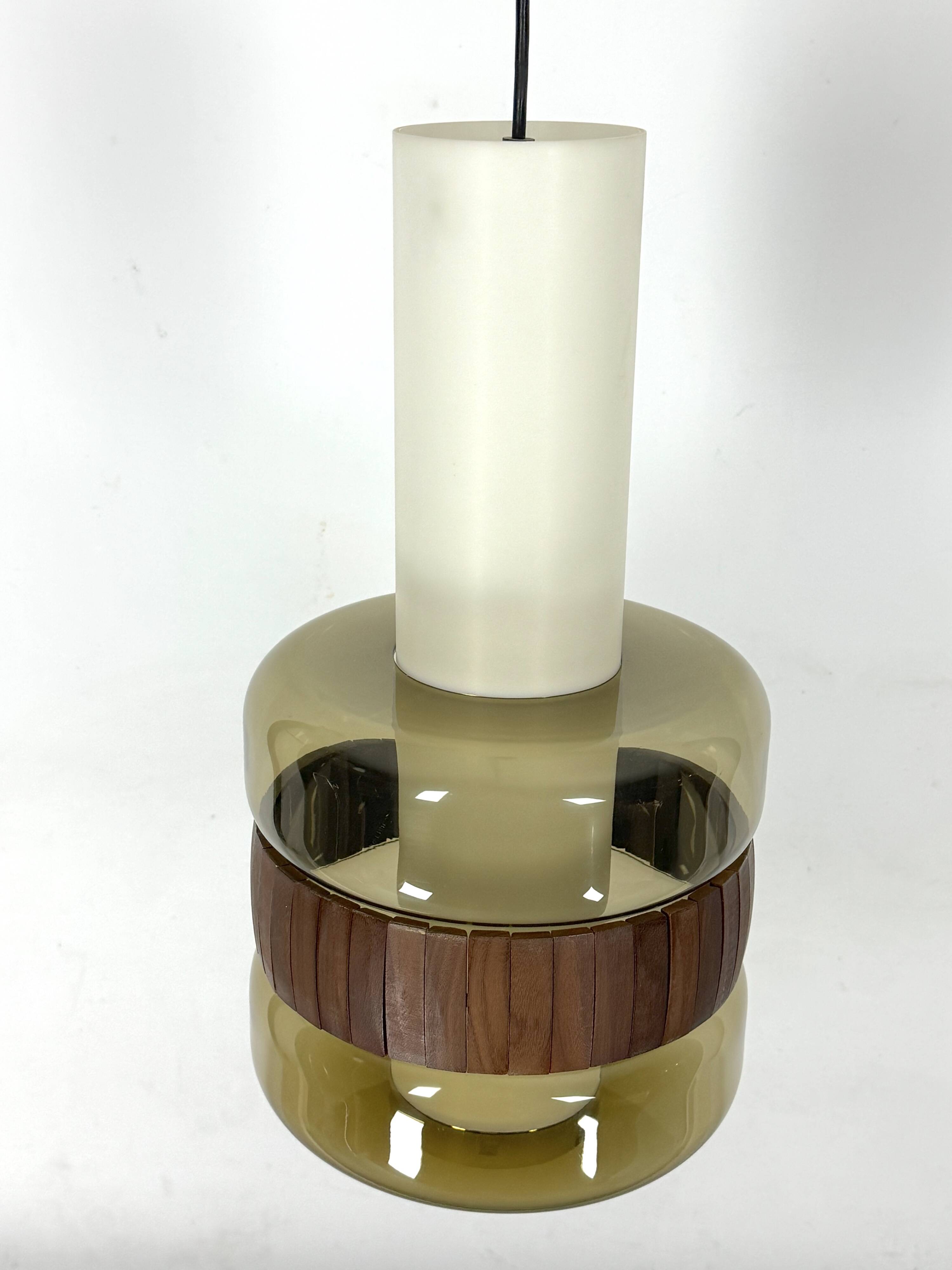 Mid-Century Harvey Guzzini pendant from 1960s. Labeled.
