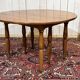 Round cherry wood table, 6 feet, Louis Philippe style with 2 extensions.