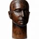 Monoxyle wood sculpture of a man's head, vintage craftsmanship from the 1950s.
