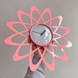 Pink Karlsson wall clock in a mid century shape