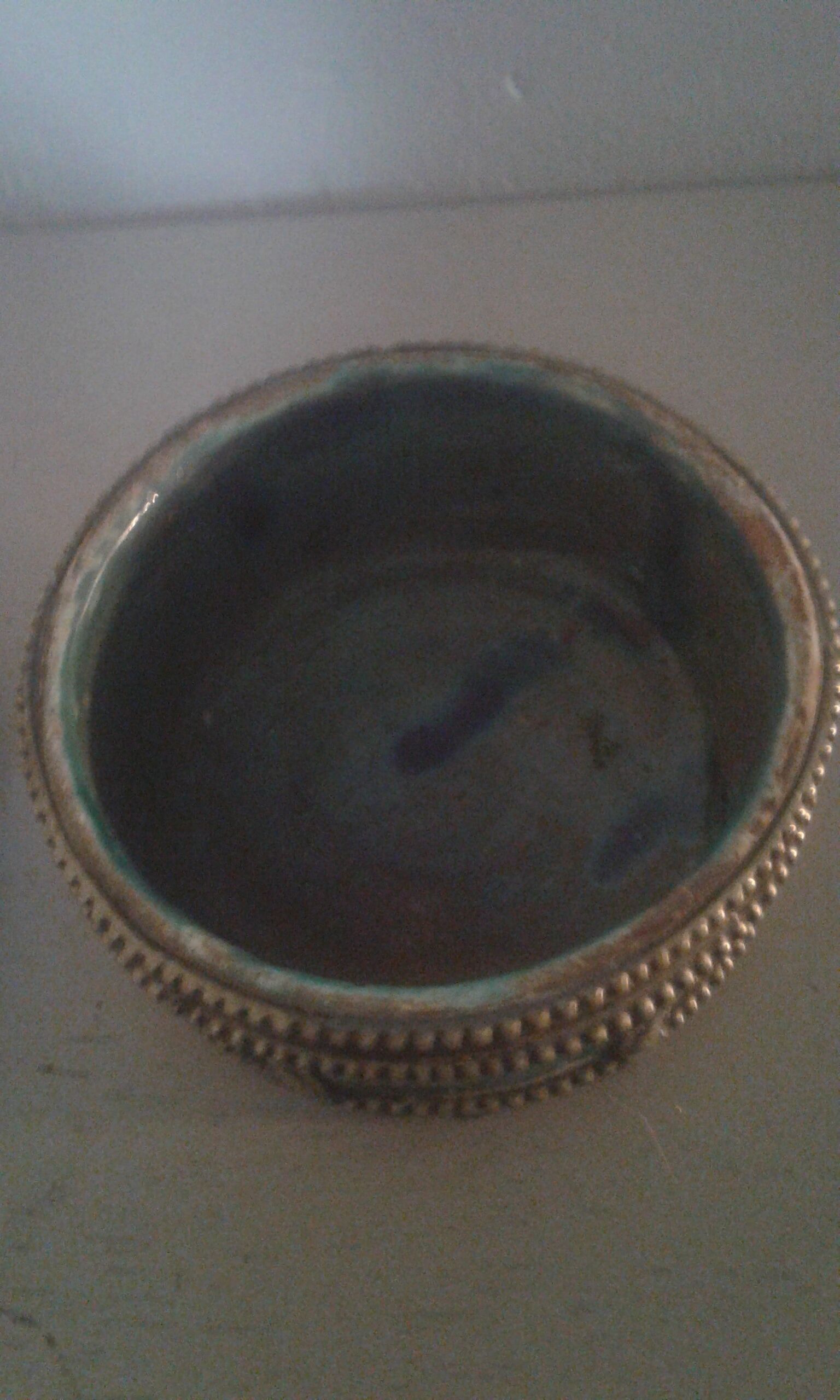Ancient box in ceramic and enamel surrounded by brass