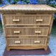 Vintage rattan chest of drawers has 3 drawers.