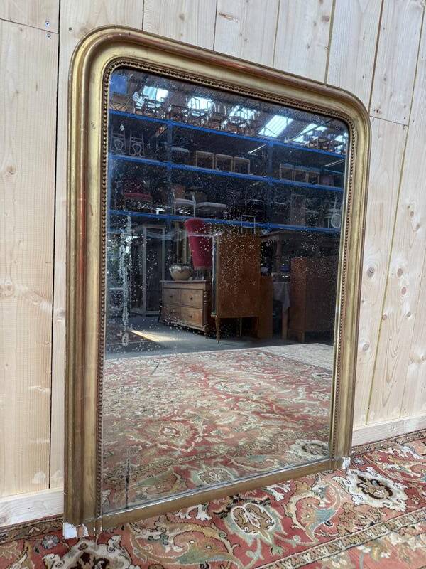 Miroir époque Louis Philippe à la feuille d'or.