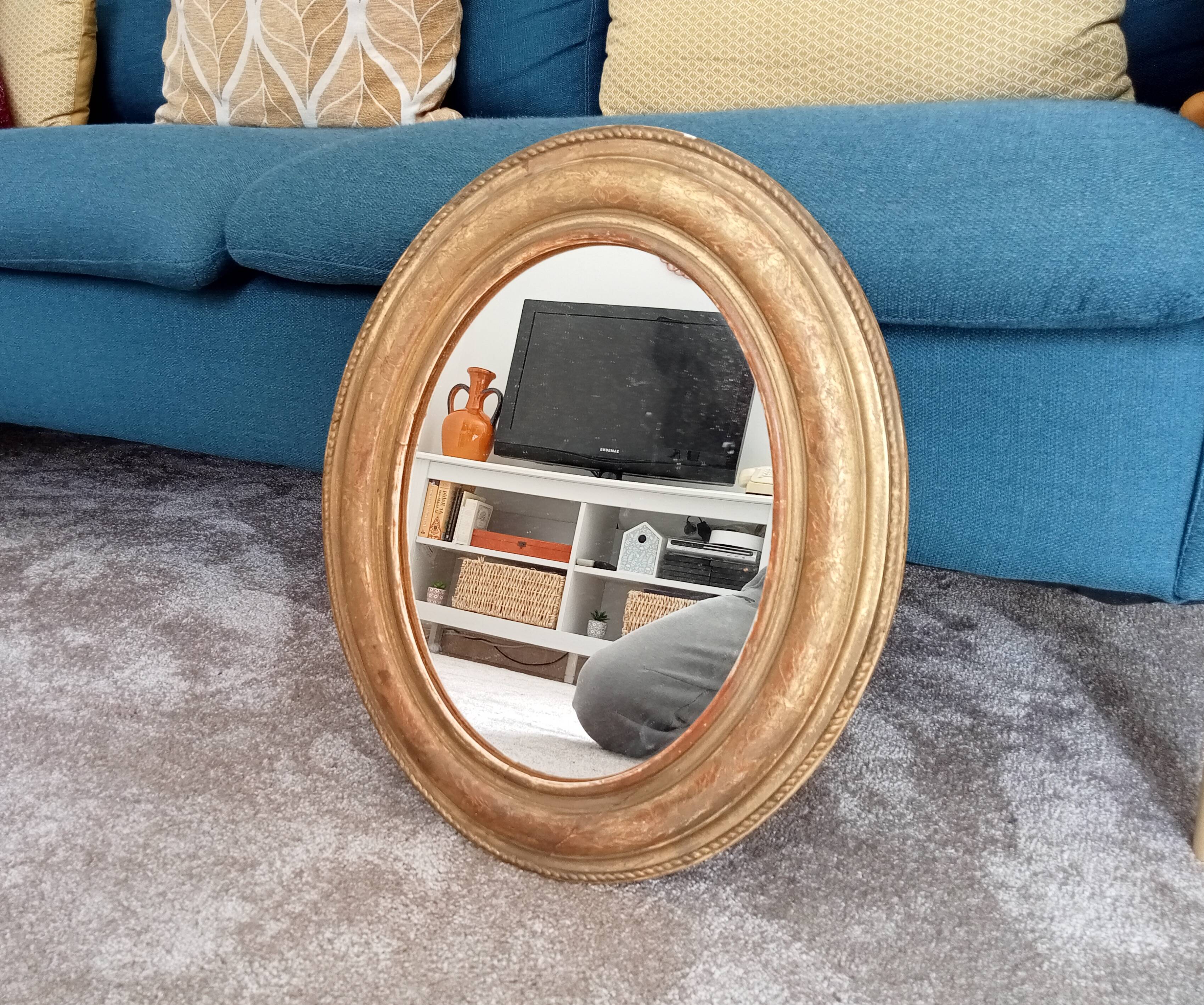 Louis Philippe 19th century oval gilded mirror in wood and stucco