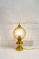 Table lamp in brass and blown glass, Caccia Dominioni style 60s