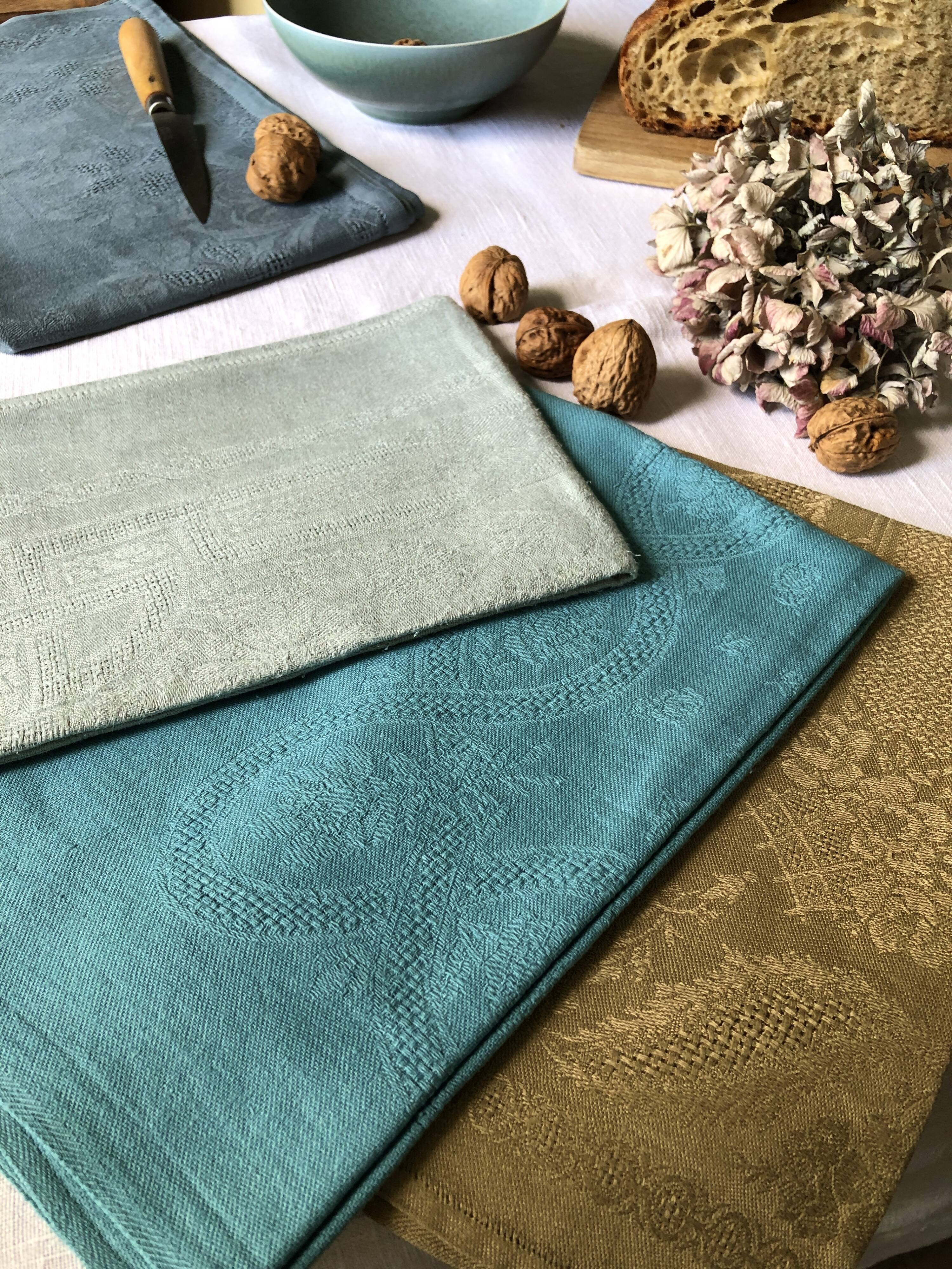 Suite of four tinted antique napkins