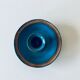 Blue enamelled sandstone candlestick