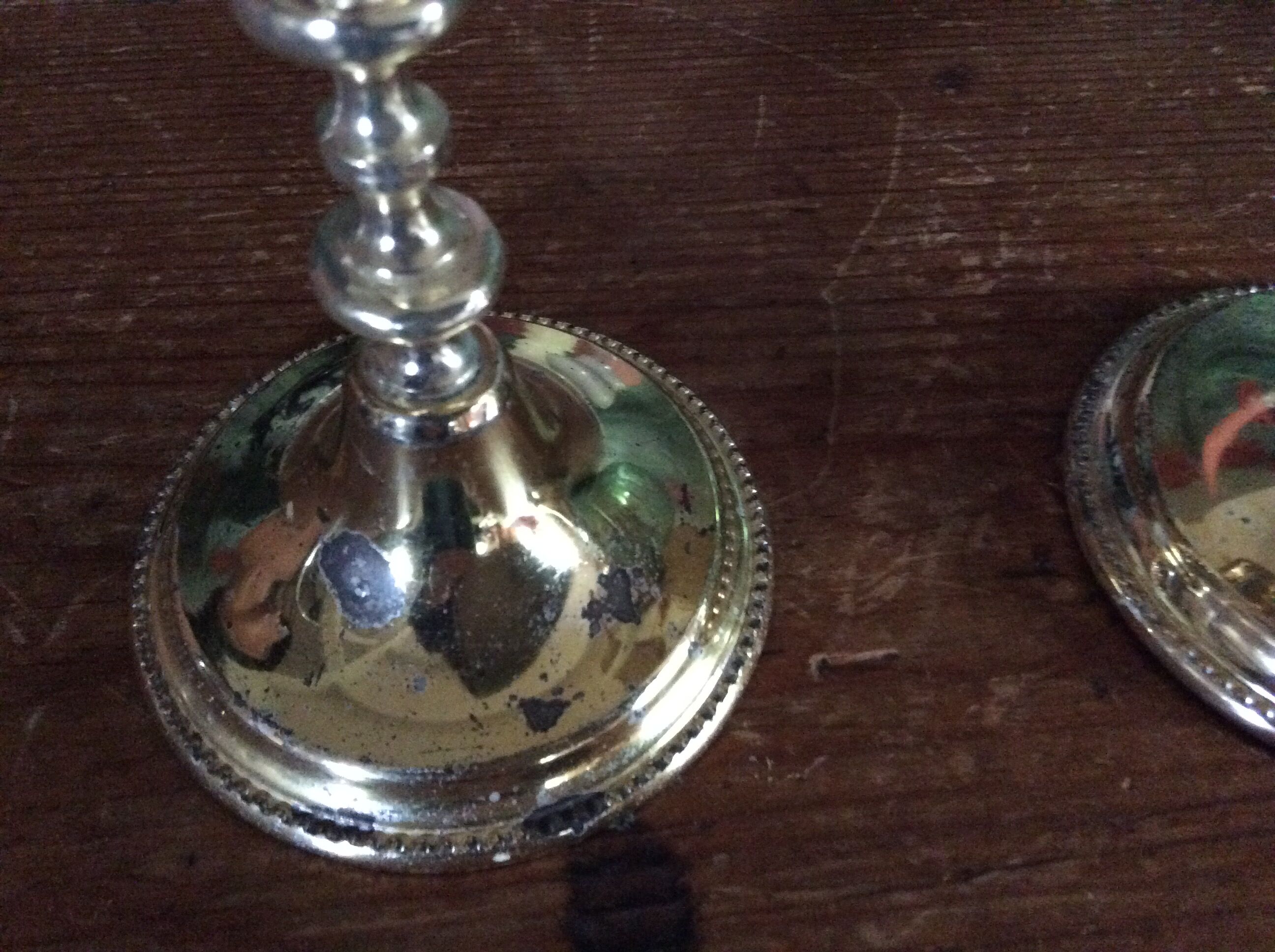 Pair of gold metal candle holders