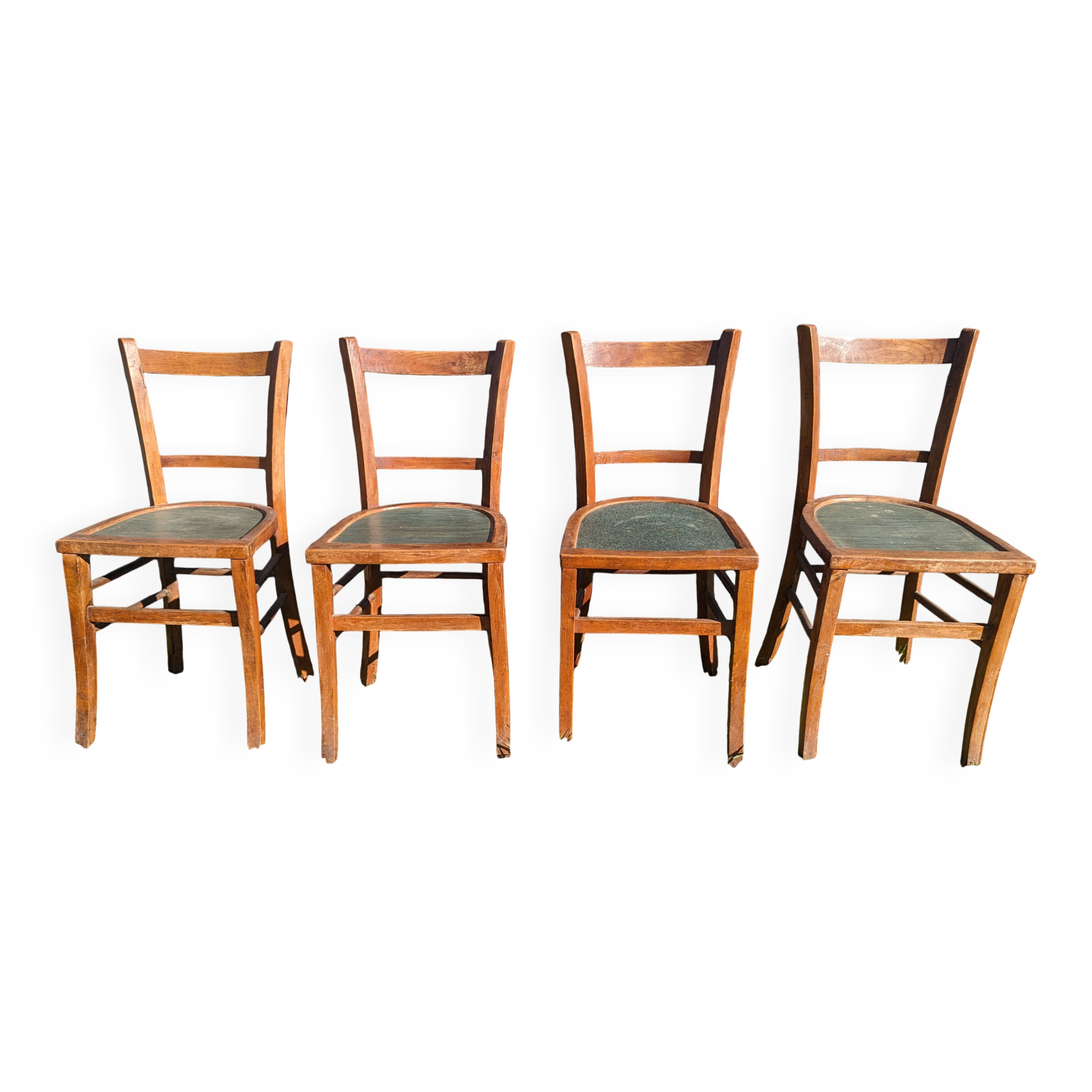 Set of four wooden bistro chairs, green seat, mid-20th century.