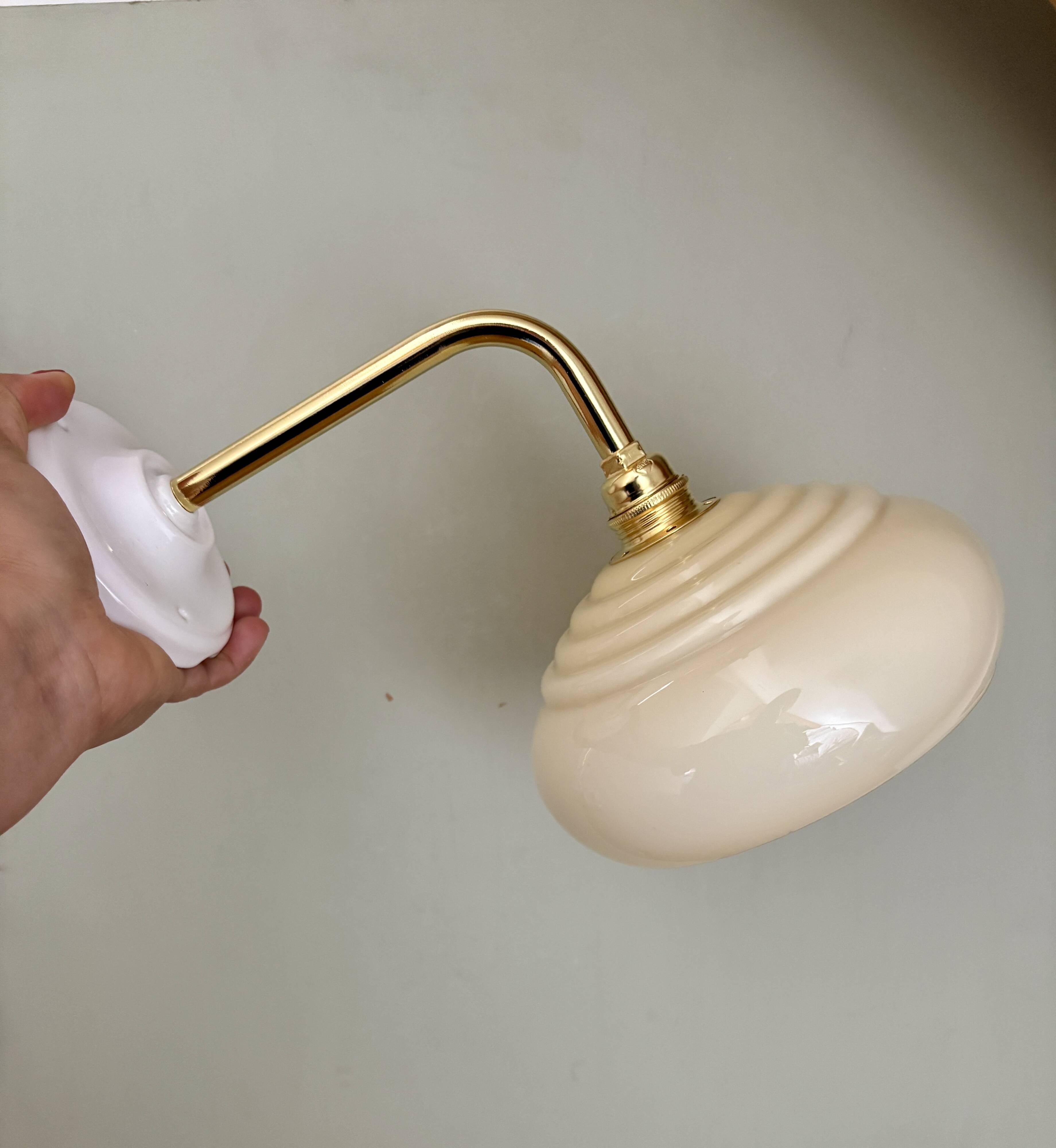 Vintage angled wall lamp with pale yellow opaline shade