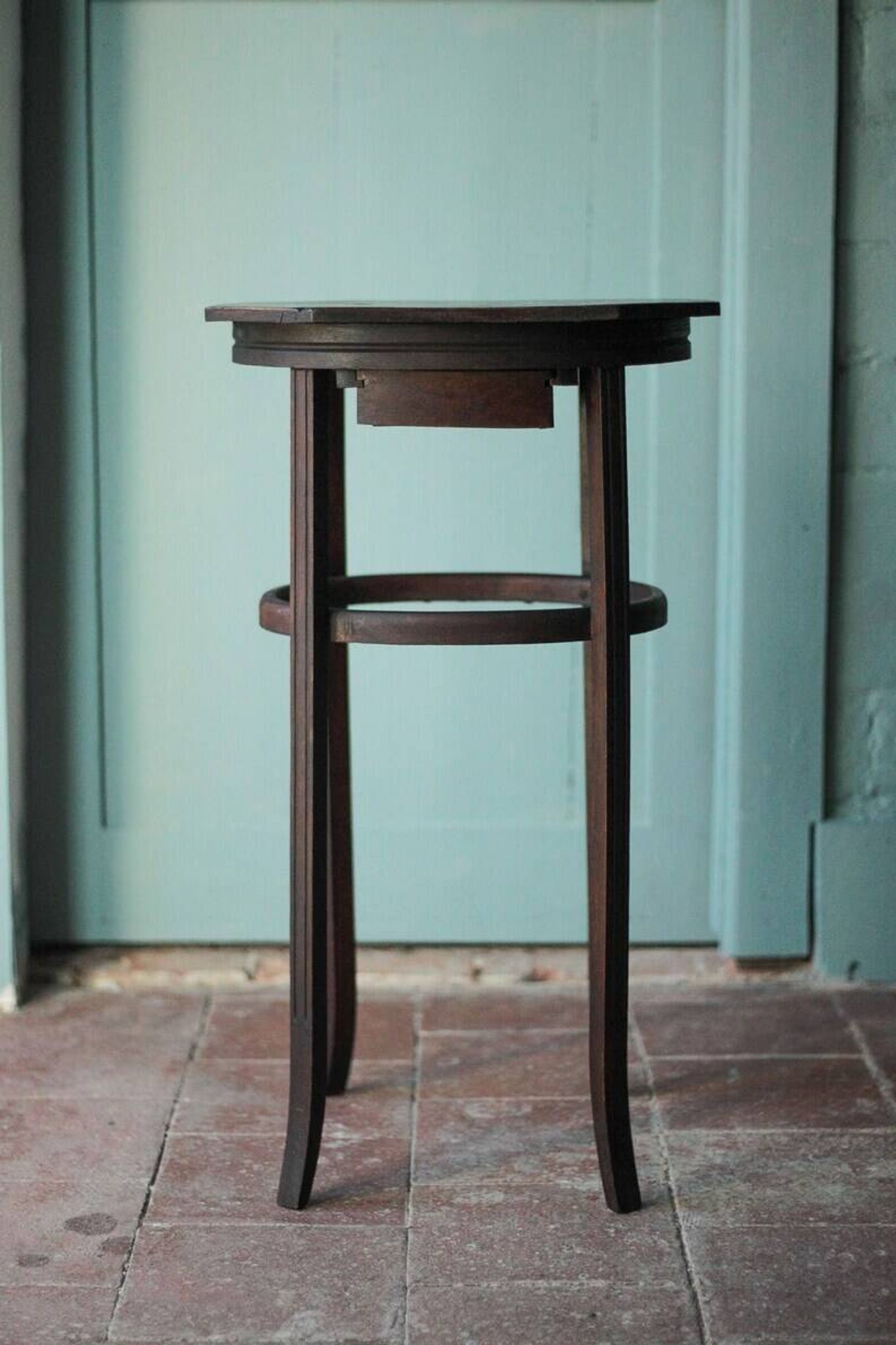 Wooden drawer table or 19th-century work table with a curved wooden stretcher, in the style of Thonet, circa 1900-1920.