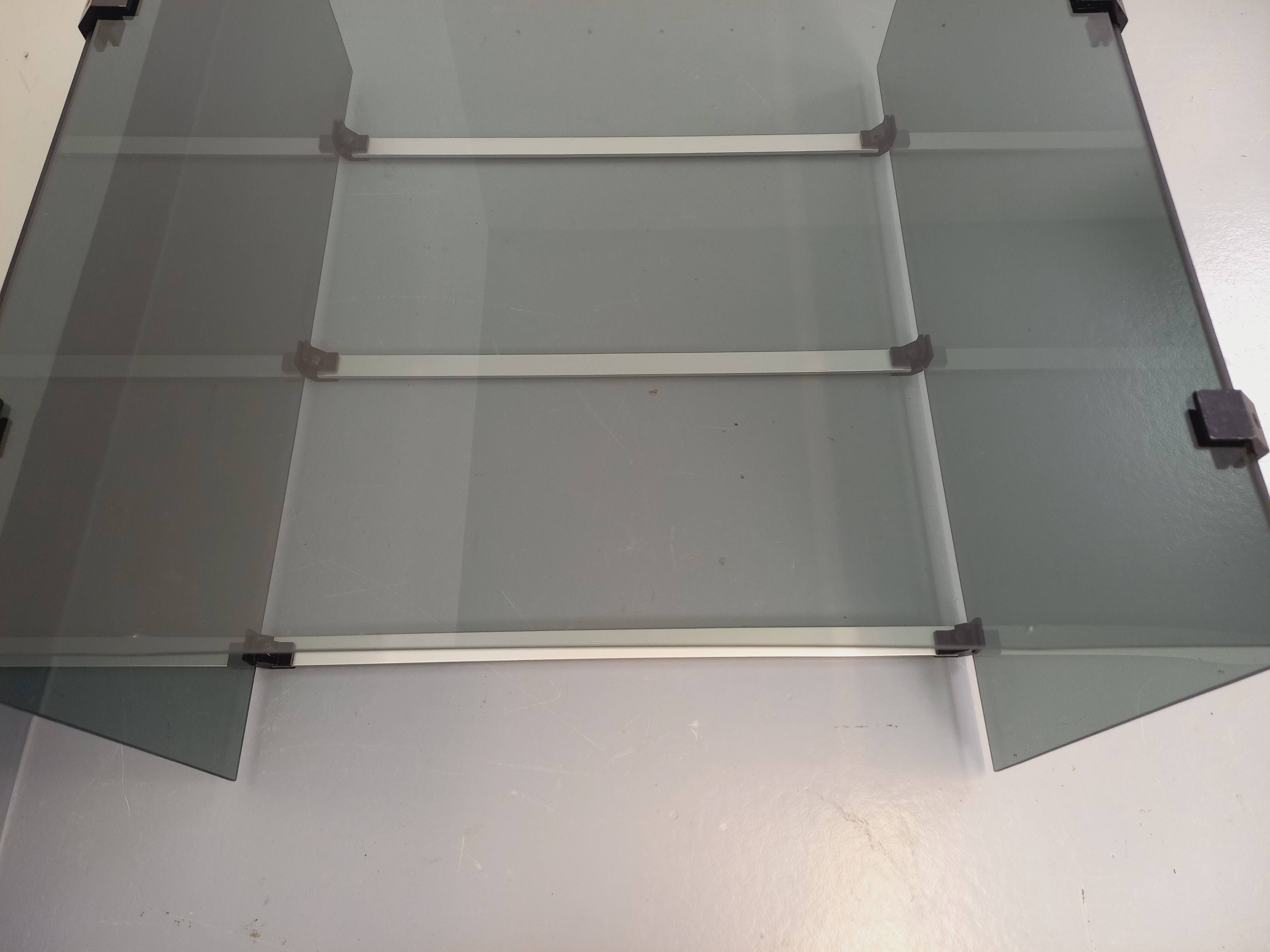 Vintage coffee table in smoked glass, black metal and cast aluminum