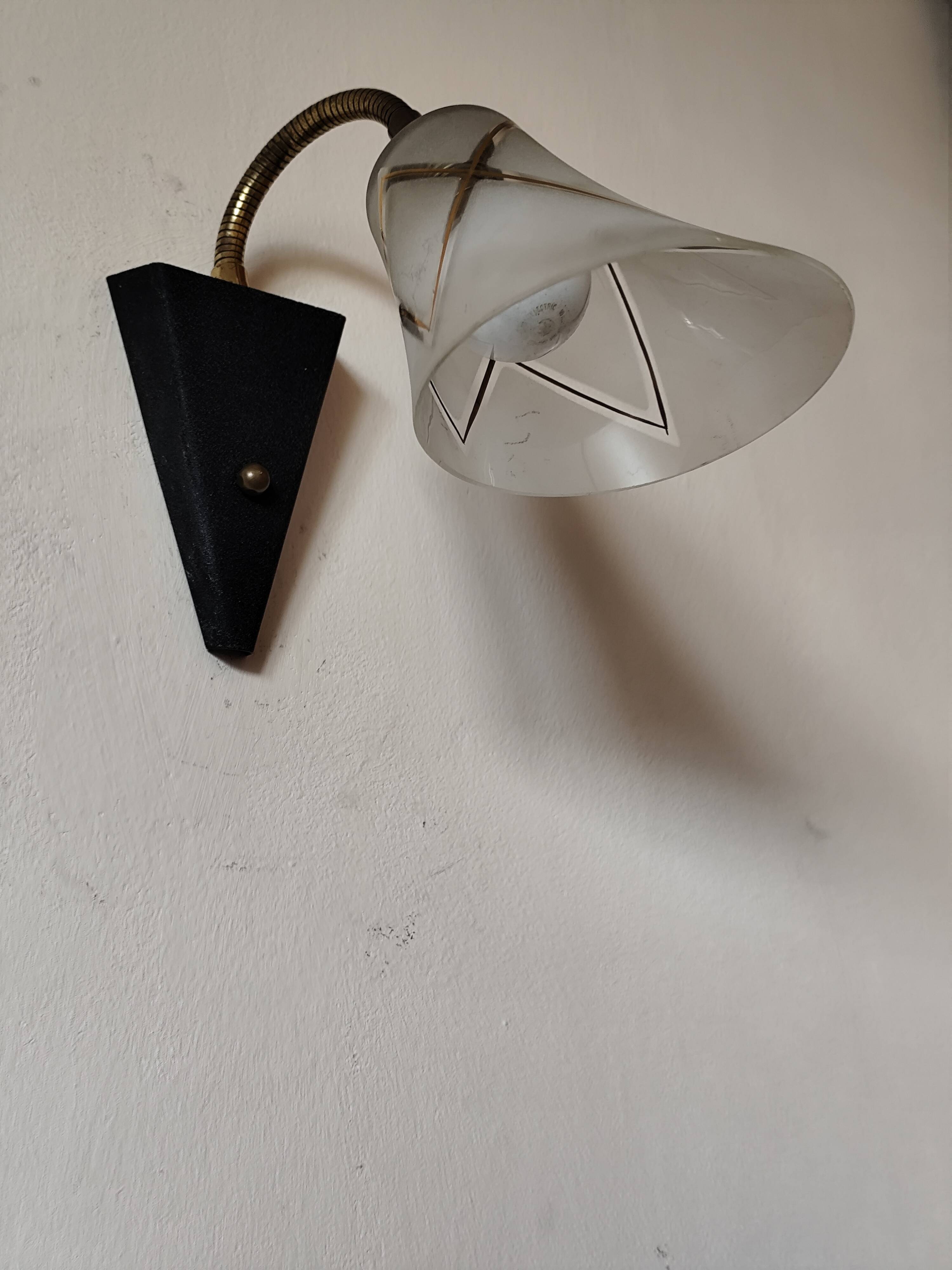 1950s wall lamp, metal, flexible brass stem and opaque shade.