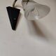 1950s wall lamp, metal, flexible brass stem and opaque shade.